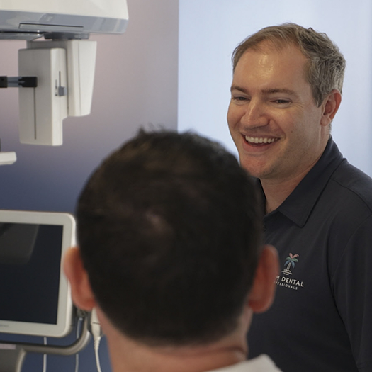 Dentist talking to a patient