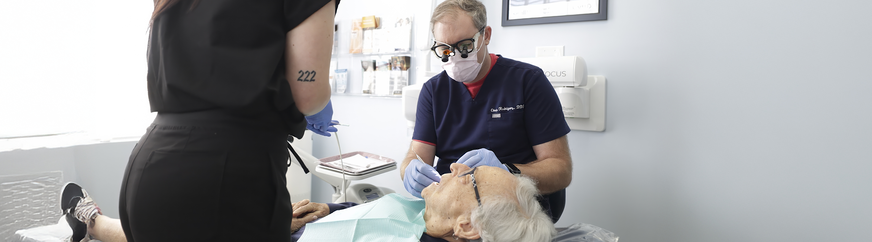 Dentist treating a patient with All on X dental implants in Jupiter