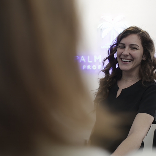 Dental team member smiling at a patient