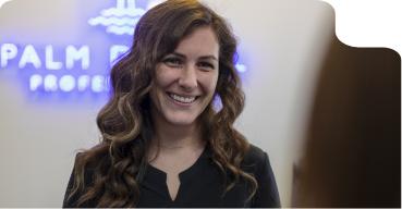 Jupiter dental team member grinning at a patient