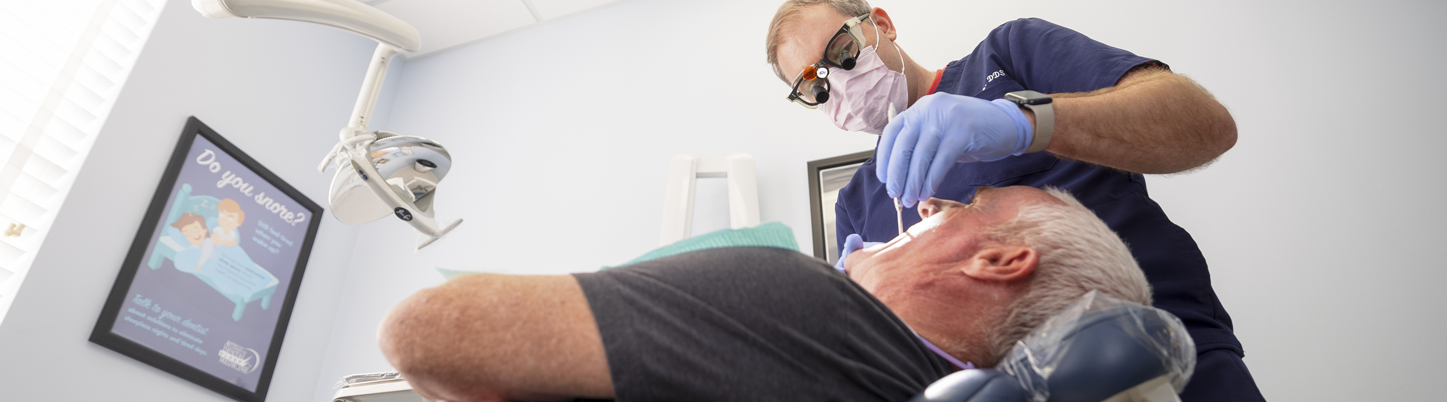 Jupiter dental implant clinical director giving a patient a dental exam